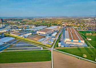 aerial photo of a industrial district between fertile farmland in Kornwestheim, Baden Wuerttemberg,...