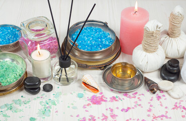 Spa items are arranged in a composition on a table.
