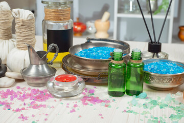 Spa items are arranged in a composition on a table.