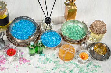 Spa items are arranged in a composition on a table.