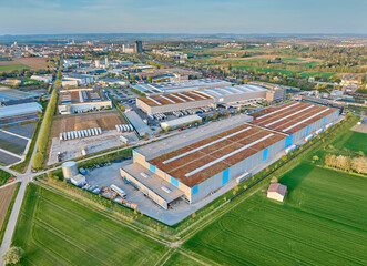 aerial photo of a industrial district between fertile farmland in Kornwestheim, Baden Wuerttemberg,...