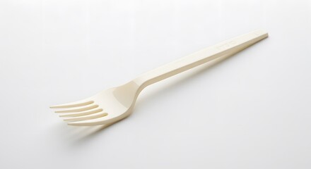 Minimalist Fork on Plain: A pristine image of a single fork, crafted with clean lines, embodying simplicity and functionality. The design invites attention with its minimalist flair.
