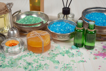 Spa massage items are arranged in a composition on the table.
