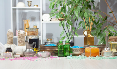 Spa treatment with candles and towel on wooden table, closeup