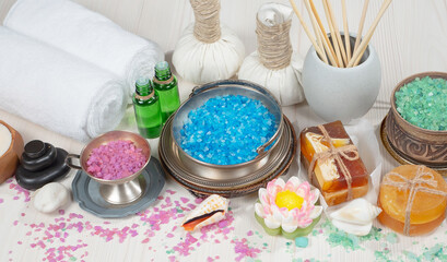 Spa massage items are arranged in a composition on the table.