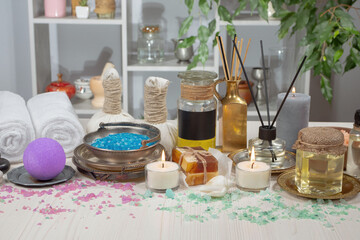 Spa items are arranged in a composition on a table.