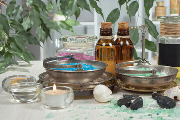 Spa items are arranged in a composition on a table.
