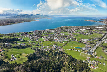 Fototapeta premium aerial view of the city of Lochau at Lake Constance with the highway entrance to Pfaender Tunnel in Vorarlberg, Austria
