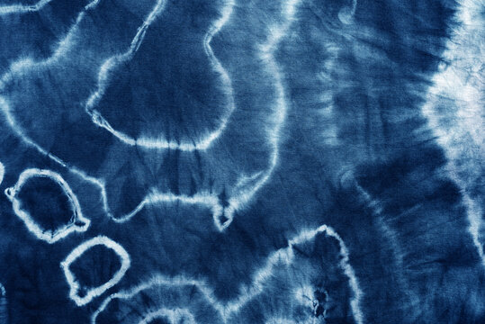 tie dye pattern hand dyed on cotton fabric abstract texture background.