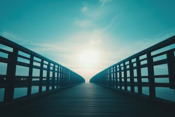 Serenity of a wooden bridge leading towards a bright horizon under a clear sky