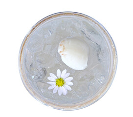 Coconut water with ice and flowers, refreshing in a glass..top view.