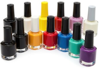 Obraz premium Assortment of colorful nail polish bottles on a white surface isoleted on white background