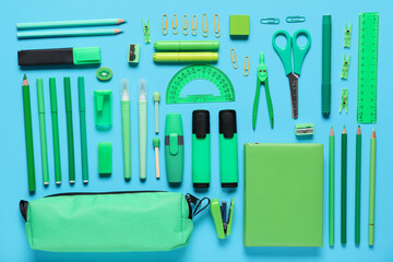 Different school stationery on turquoise background. Top view