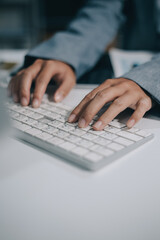Obraz premium Portrait of Asian young female working on laptop at office