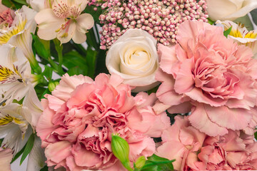 Bouquet of  soft pink flowers in wrapping paper.