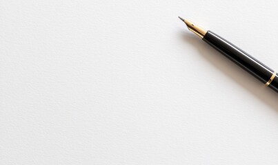 A black fountain pen on white paper