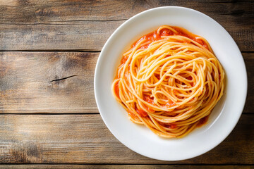 A plate of pasta topped with rich tomato sauce and fresh basil, served on a wooden table, showcasing a delightful and flavorful Italian meal.