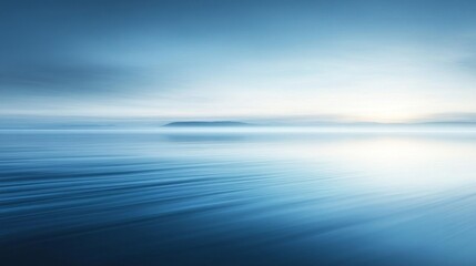 Obraz premium Serene Blue Lake at Dawn with Mist and Distant Shore