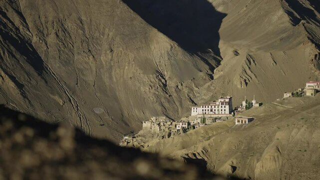 4K footage of the unique moon-like scenery in Lamayuru Moonland, Kargil Ladakh, India, highlighting a monastery and the expansive dry desert terrain.