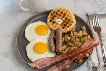 fried eggs with waffles  top with melted butter and  syrup