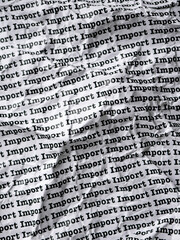 Words Import Seamless print on Crumpled paper for trading export import business tax background.