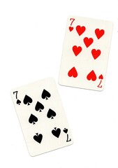 A pair of playing cards of the same value isolated on a white background.