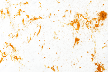 Turmeric powder scattered lightly on a seamless white background, ideal for food styling.