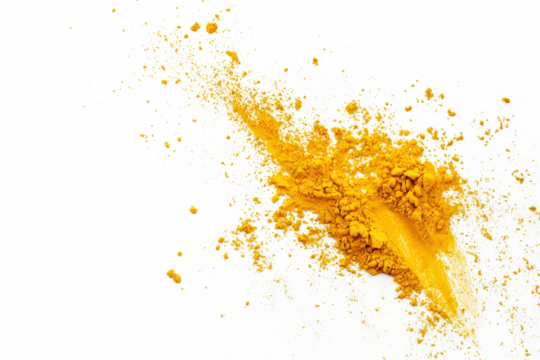 Turmeric powder scattered lightly on a seamless white background, ideal for food styling.