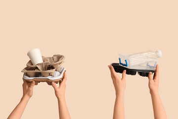 Female hands with garbage on beige background. Global Recycling Day