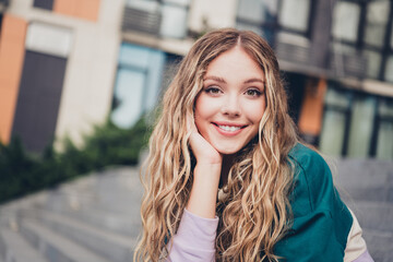 Photo of nice young girl sit stairs beaming smile wear top downtown street outdoors