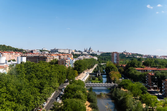 Madrid, Comunidad de Madrid, Spain. August 28, 2022: Aerial view of Madrid's cityscape with historic architecture and lush greenery. - Powered by Adobe