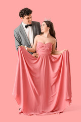 Pretty prom couple on pink background