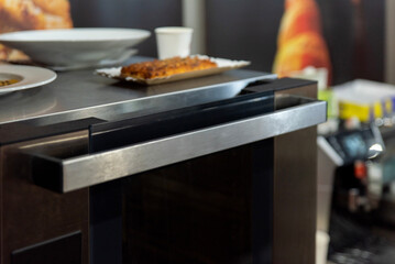 Modern convection oven with metal handle