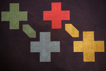 Colorful crosses creating a dynamic pattern on dark background