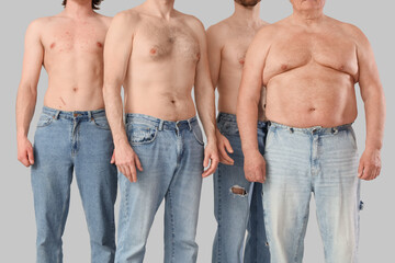 Group of men on grey background. Body positive concept