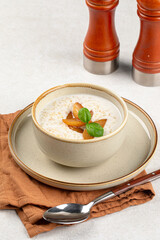 Portion of gourmet breakfast porridge cereals with peach