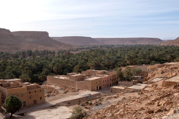 Morocco - oasis with ancient village, kasbah, on the road to Erg Chebbi Sahara desert, North Africa
