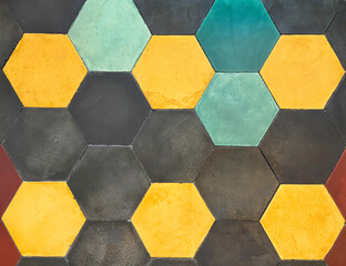 Close up of colorful hexagon tiles for flooring, in black, cyan, blue, yellow, and red color....
