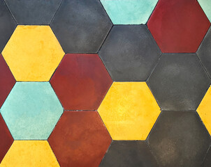 Close up of colorful hexagon tiles for flooring, in black, cyan, blue, yellow, and red color....