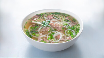 Vietnamese cuisine. Pho Noodle Soup. Vietnam traditional pho, Beef noodles. Pho Bo Soup with beef, rice noodles, ginger, lime, chili pepper in bowl.