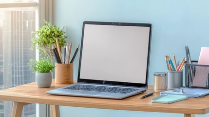 Modern workspace with laptop, desk organizer, and greenery in stylish office setting showcasing productivity and creativity in a bright environment