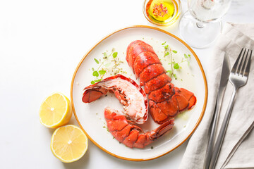 Delicious tails of boiled lobsters served on white table, flat lay