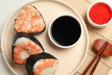 Tasty onigiri (Japanese rice balls) with shrimps served on table, flat lay