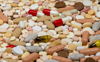 Close-up of many different pills and capsules