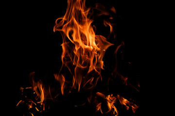 Fototapeta premium Vibrant Flames Dancing Against Dark Background for Creative Use