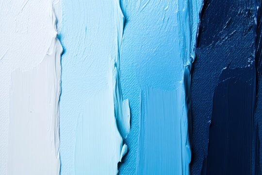 A close up of a series of blue paint swatches ranging from light to dark creating an abstract design - Powered by Adobe