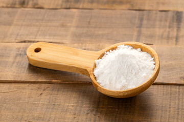 Baking soda powder in spoon - Healthy food.
