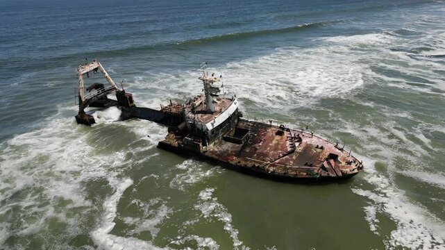Aerial drone view of Zeila Shipwreck Namibia washed by waves on the South Atlantic Ocean