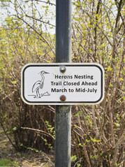 Trail closing sign at the Great Blue Heron Nature Reserve during a spring season in Chilliwack, Fraser Valley, British Columbia, Canada