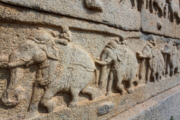 Elephant sculptures on a wall of the royal baths (Mahavani Dibba) in Hampi, Karnataka, India, Asia